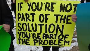 A person holding a sign at a protest